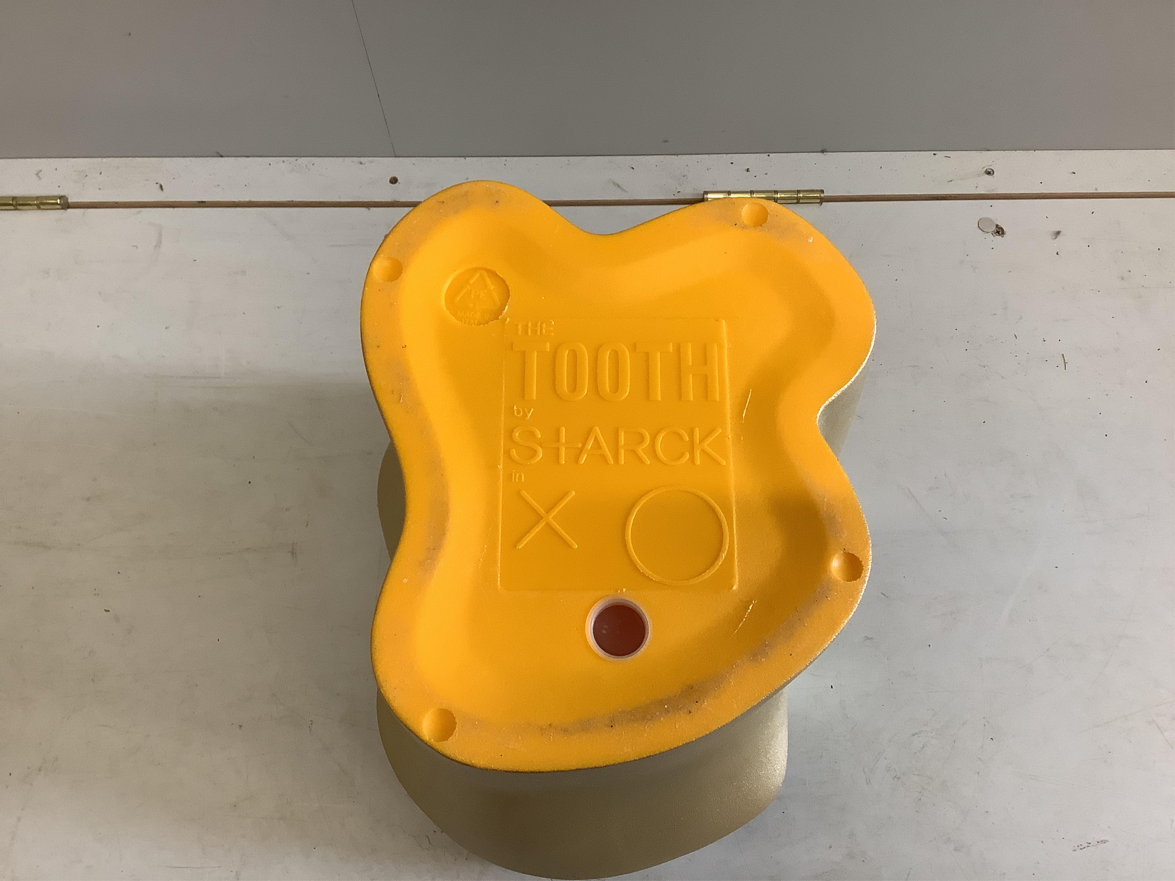 A Philippe Starck 'The Tooth' stool, width 36cm, depth 32cm, height 41cm. Condition - fair